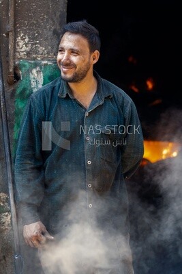 Man working in a workshop to melts metal, workshop, activities