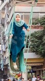 Children&#39;s playing in a swing at eid, street, festival