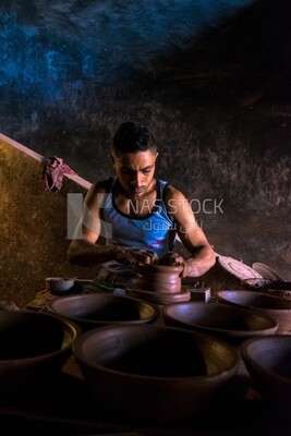 Man works in a pottery workshop, workshop, activities