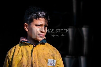 Close up photo of a boy looking away, random