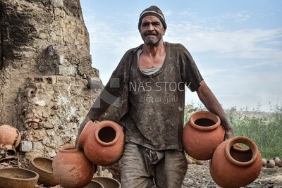 Craftsman carrying crockery