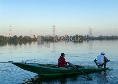 Boat with fishermen in the Nile River catching fish