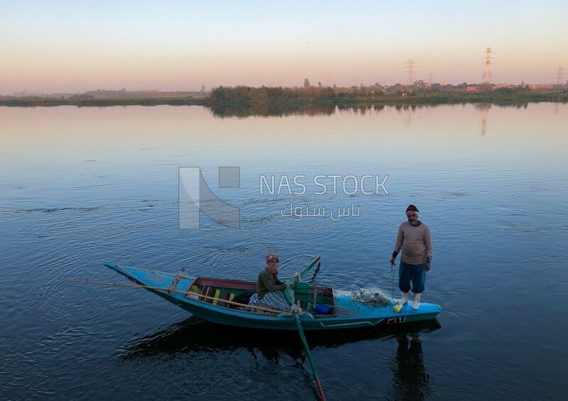 Fishermen catch fish at sunset