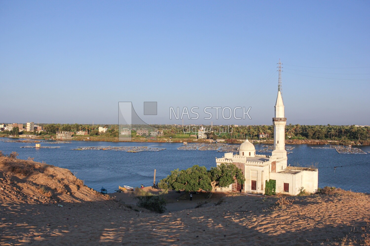 A scene of a mosque overlooking the Nile