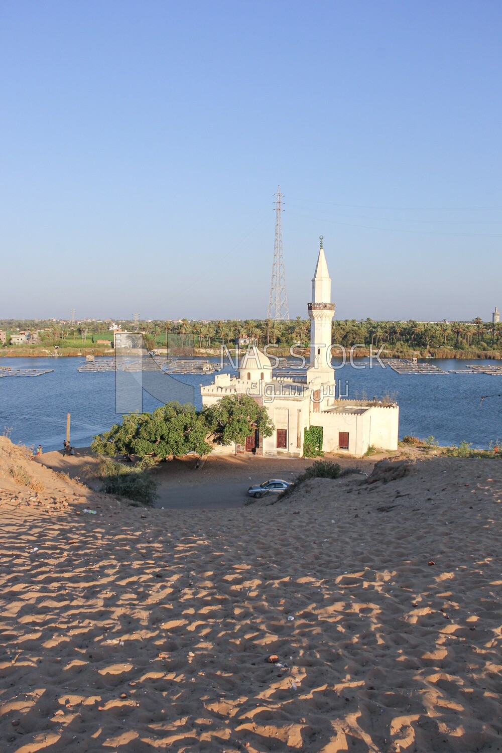 A scene of a mosque overlooking the Nile