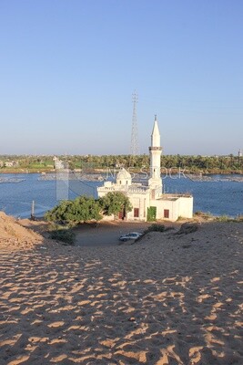A scene of a mosque overlooking the Nile