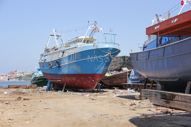 Old ships moored to the beach