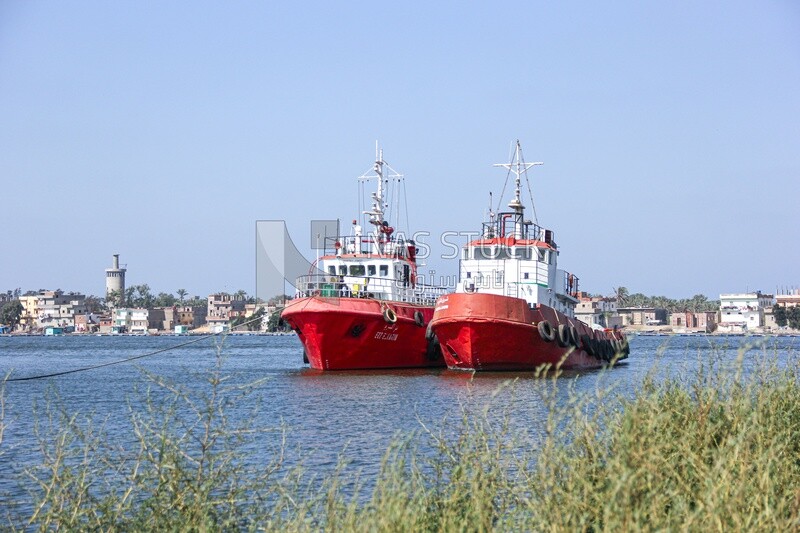 Two tugboats moored in the Nile