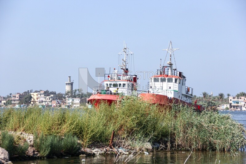 Two tugboats moored in the Nile