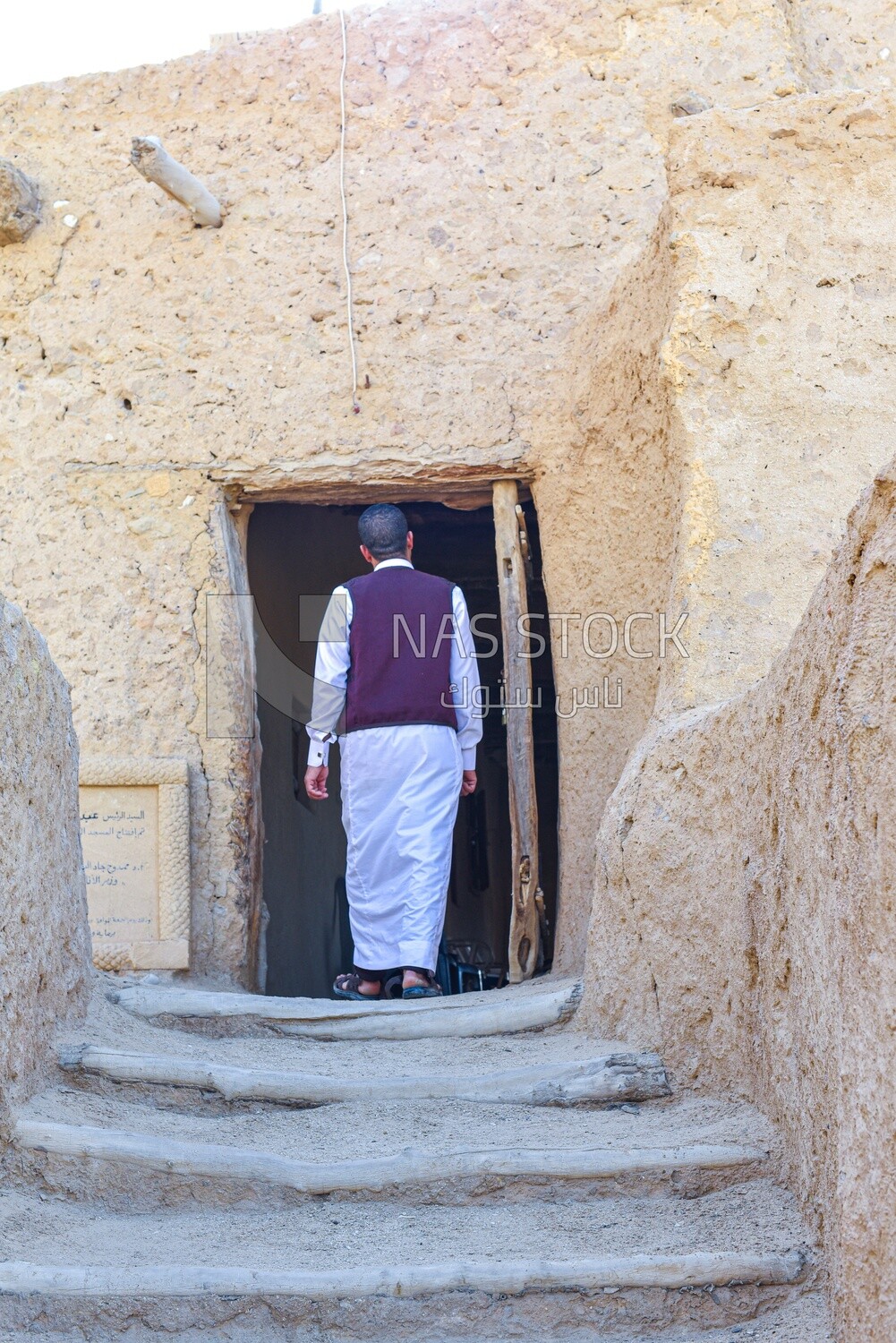 Siwa man enters a mosque