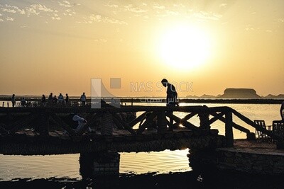 A scene of people enjoying the sunset in Siwa, Egypt