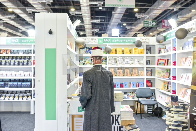Imam looking for books at a book fair