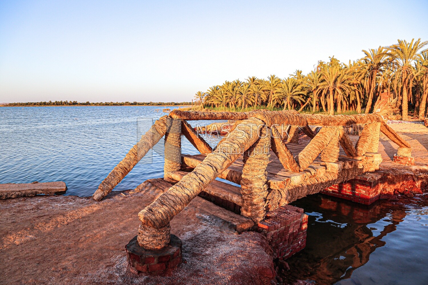 Scene of a small bridge over Lake Siwa, Egypt