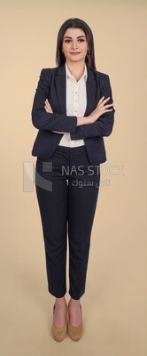 Photo of a businesswoman standing with crossed hands, meeting at the workplace, discussing work tasks, taking notes on the board