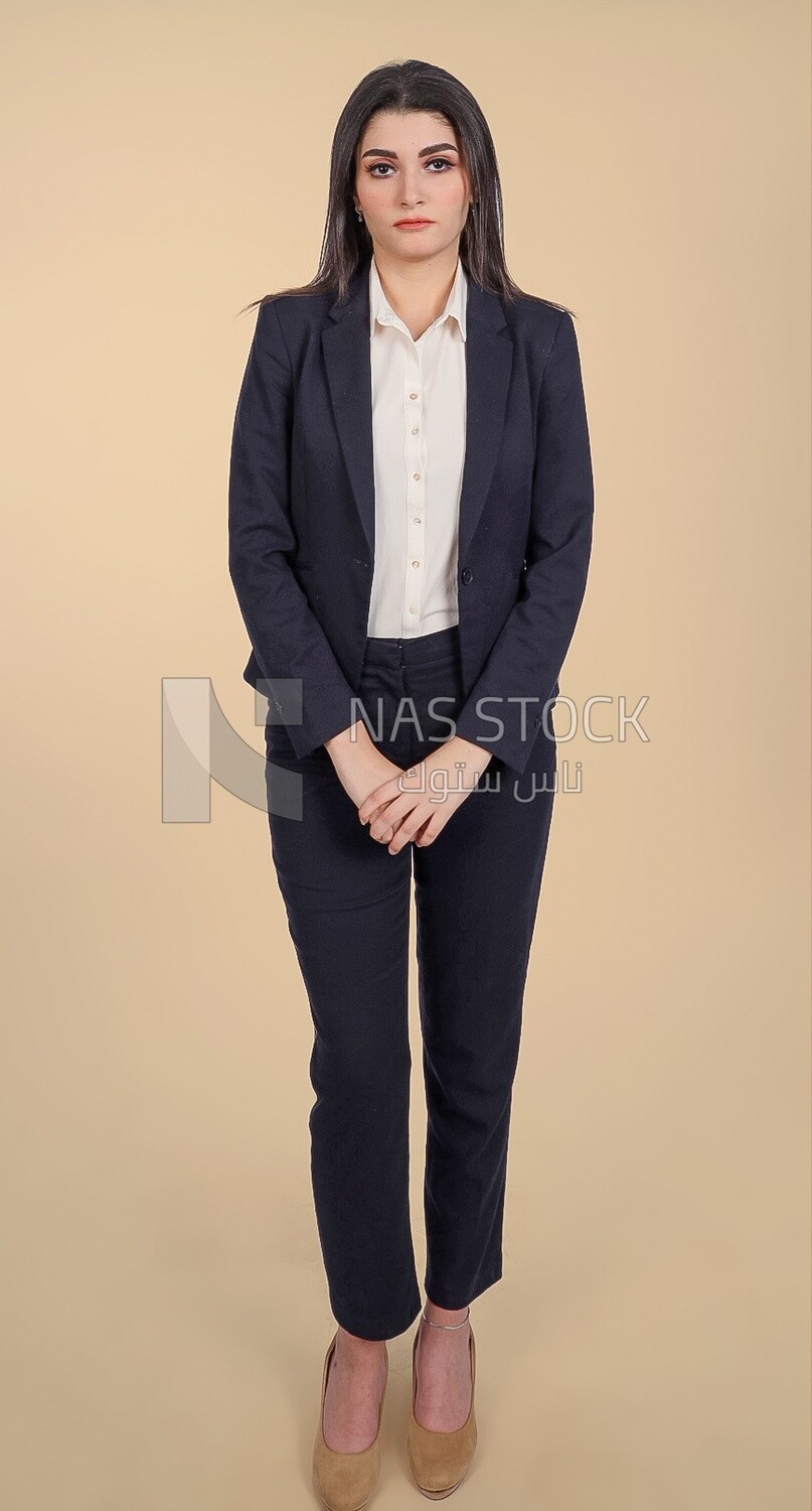 Photo of a businesswoman standing, meeting at the workplace, discussing work tasks, taking notes on the board