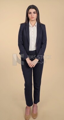 Photo of a businesswoman standing, meeting at the workplace, discussing work tasks, taking notes on the board