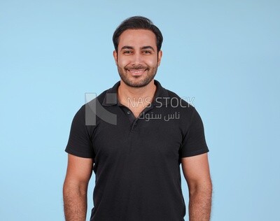 Portrait Of Handsome man Standing, Smiling Man, Wearing Casual Clothes Posing In Light Room Interior, Smiling At Camera