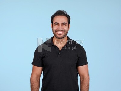 Portrait Of Handsome man Standing, Smiling Man, Wearing Casual Clothes Posing In a Light Room Interior, Smiling At the Camera