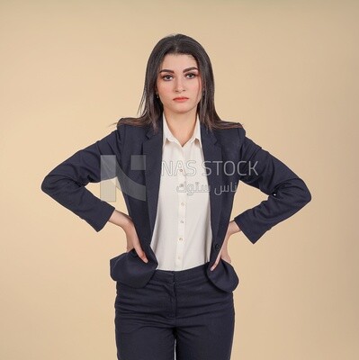 Business woman puts her hands on waist, meeting at the workplace, discussing work tasks, taking notes on the board