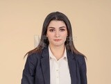 Portrait of a businesswoman standing, meeting at the workplace, discussing work tasks, taking notes on the board