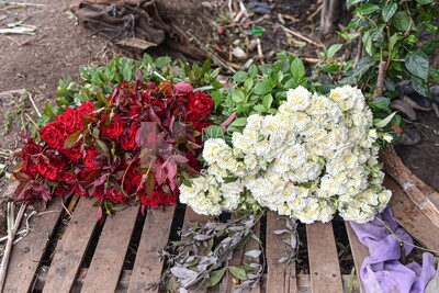 The scene of bunches of red and yellow flowers collected after being harvested