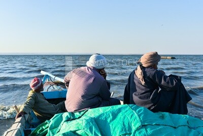 Fishermen sailing by boat in the Nile River
