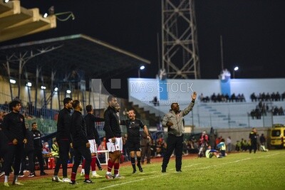 Team coach instructs the players