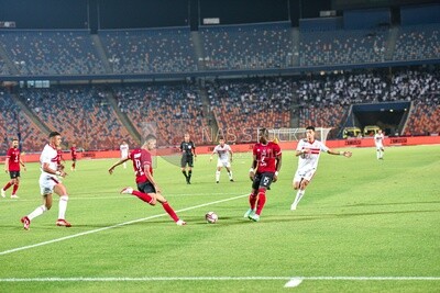 Two football teams are competing for the ball