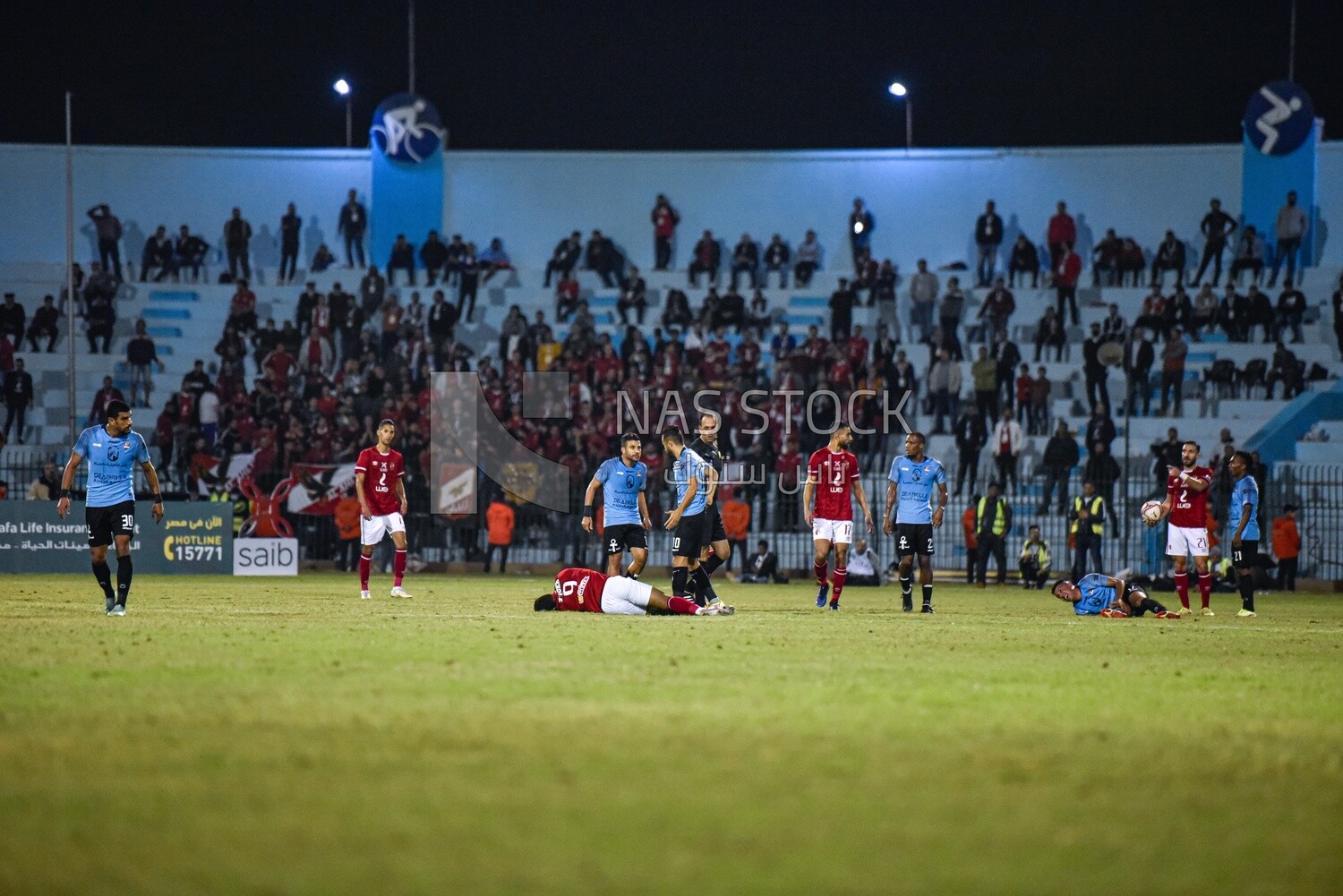 Two injured soccer players on the field