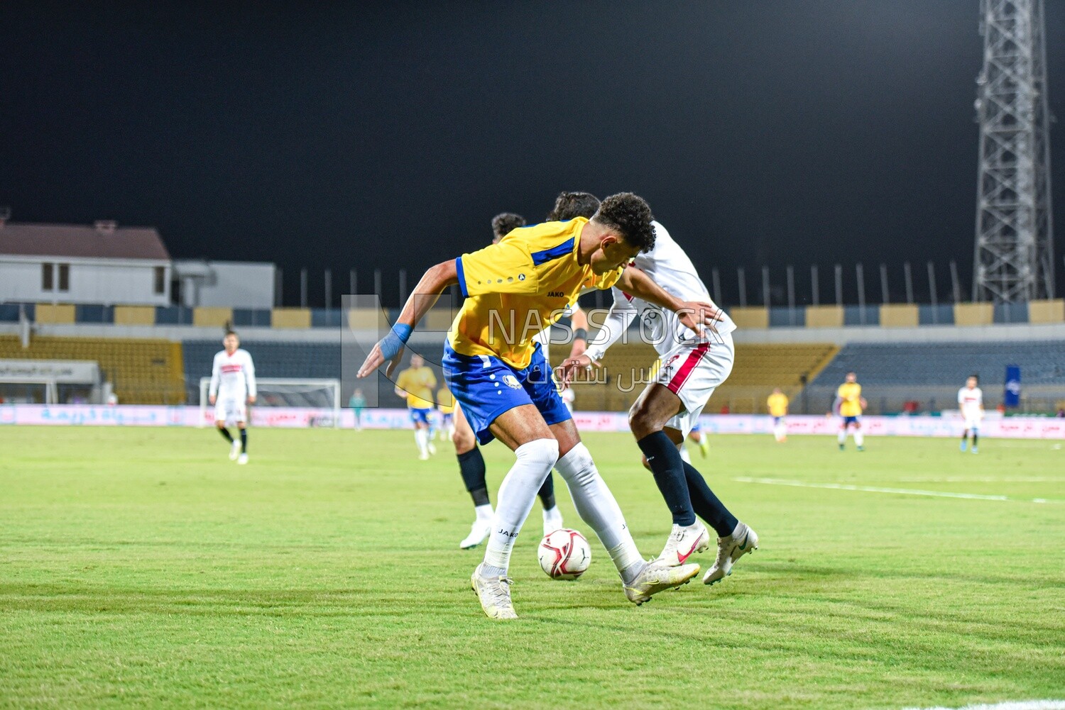 Two football teams are competing for the ball