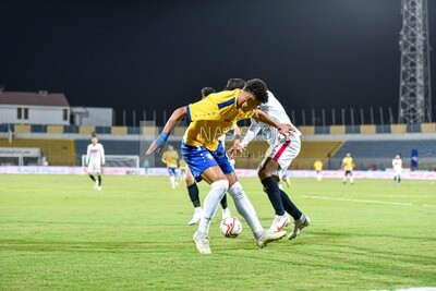 Two football teams are competing for the ball