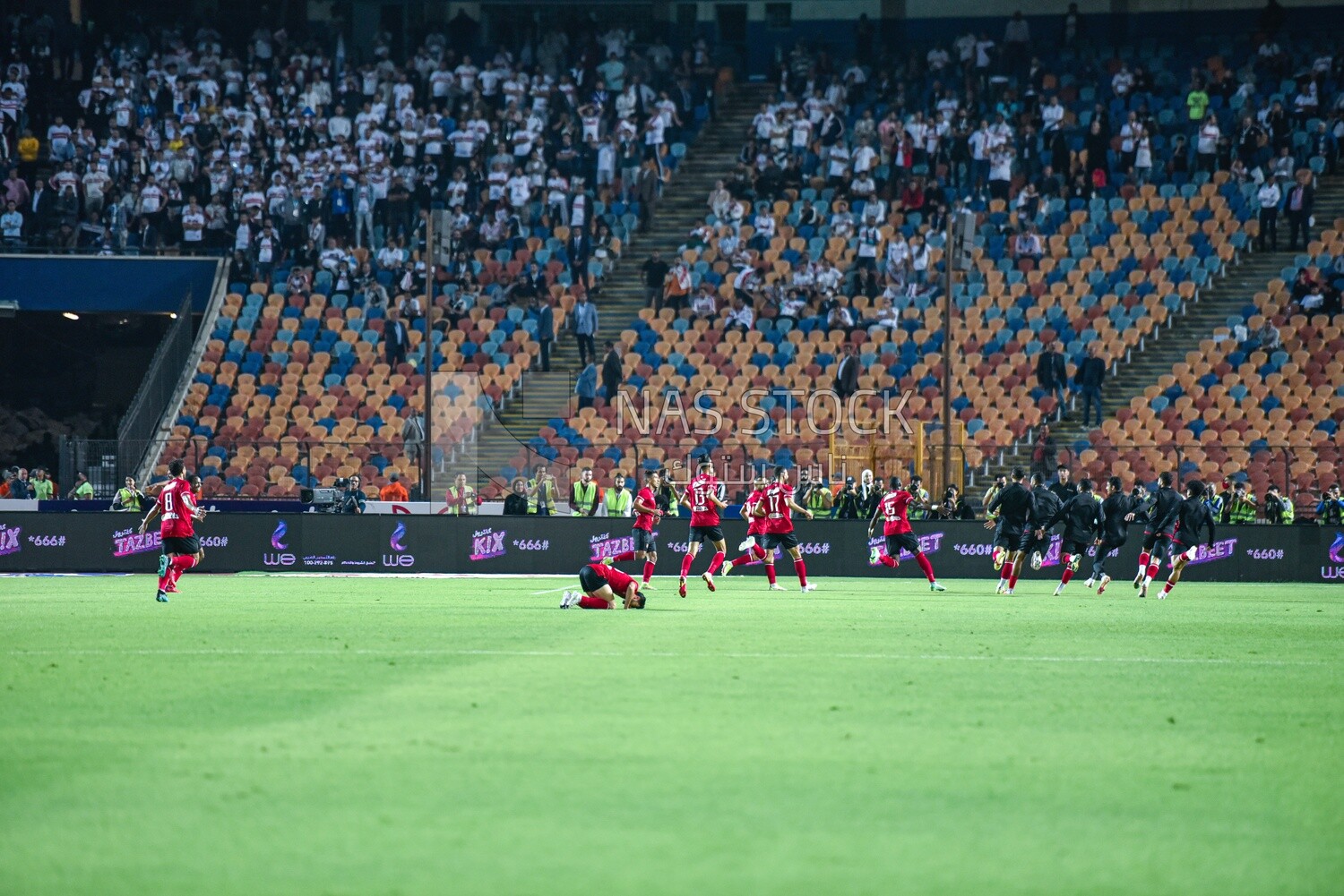 Football team celebrates after scoring a goal