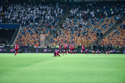 Football team celebrates after scoring a goal