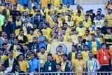 Football fans in the stadium waiting for the start of the match