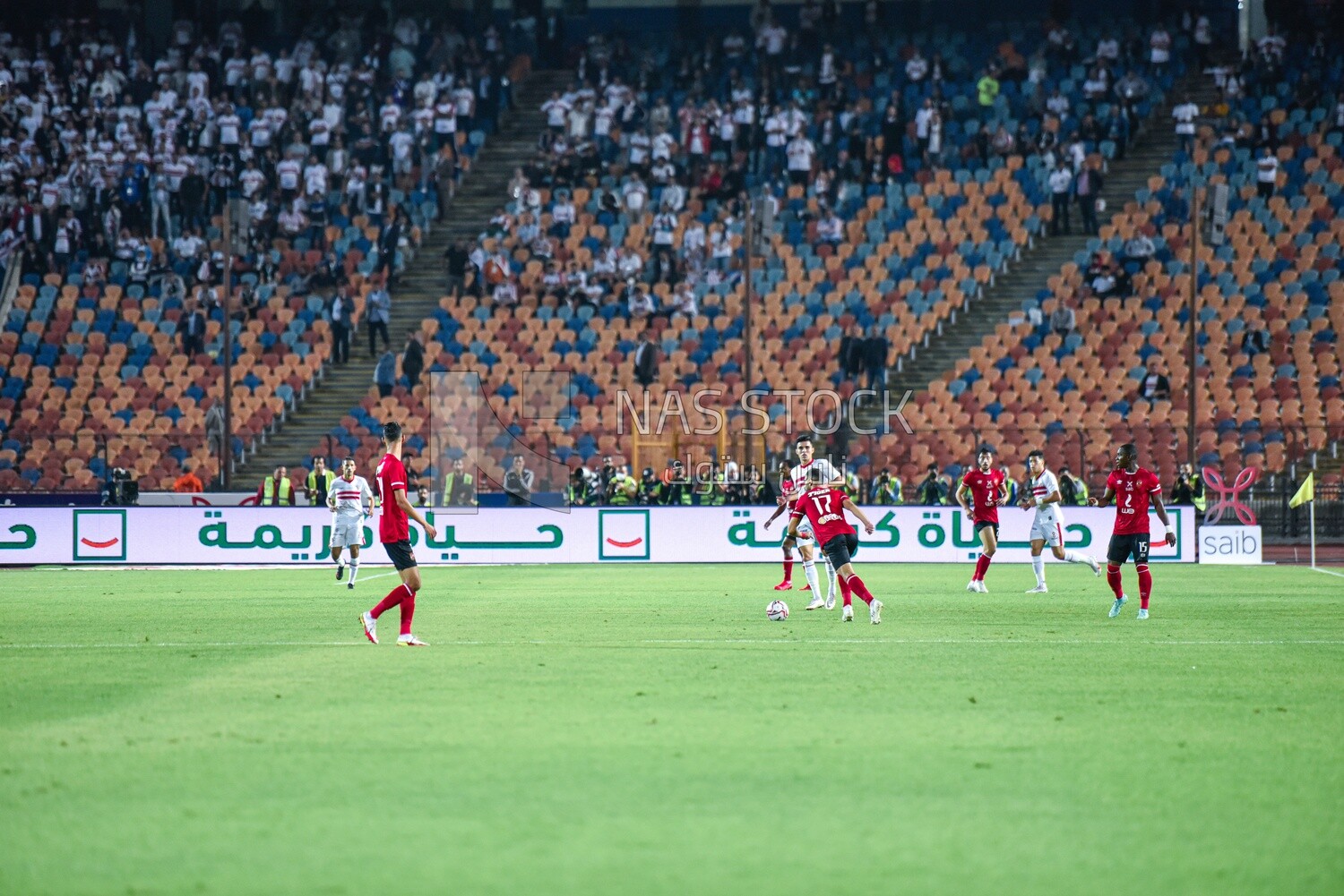 Two football teams are competing for the ball