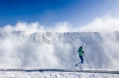 An Egyptian craftsman standing in the middle of the white brick mountains