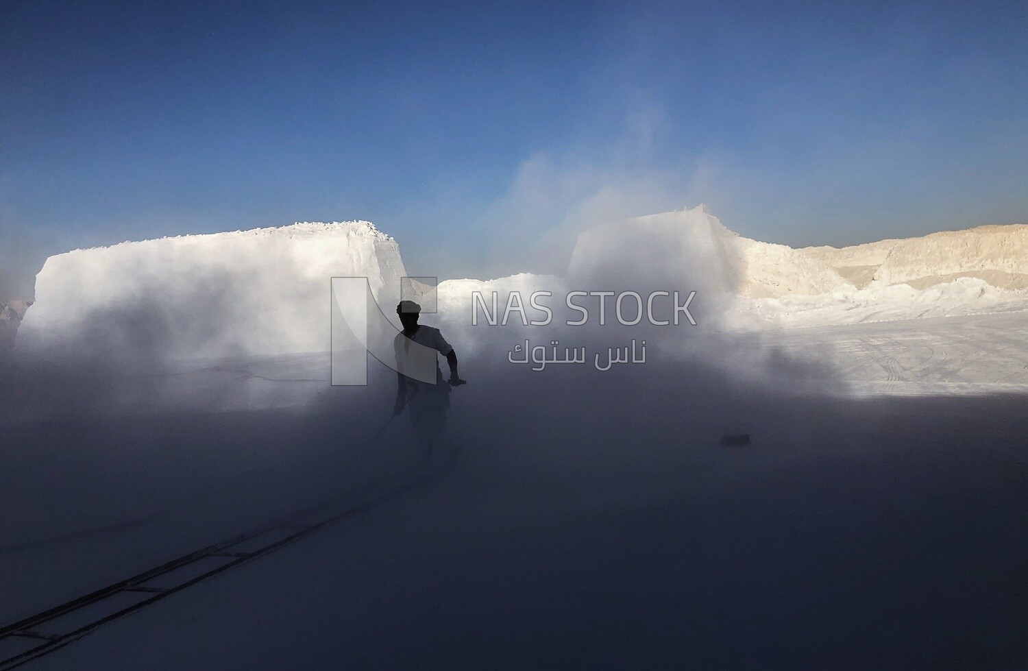 A scene of a craftsman working in the mist outside a brickyard