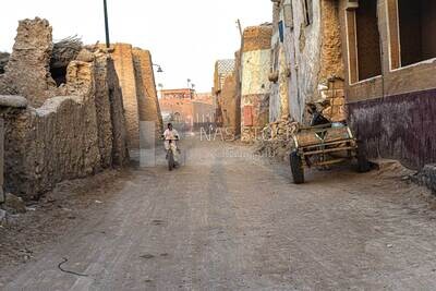 Child riding a bicycle in one of the streets of Siwa