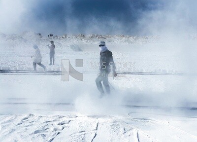 A scene of a worker in the white brick industry standing amidst the mist and smoke of the bricks