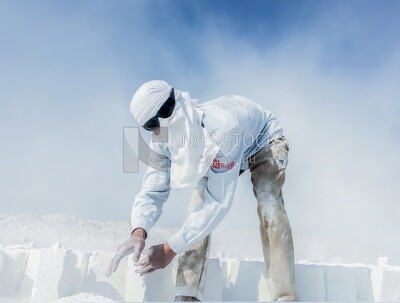 A scene of a worker in the white brick industry standing amidst the mist and smoke of the bricks
