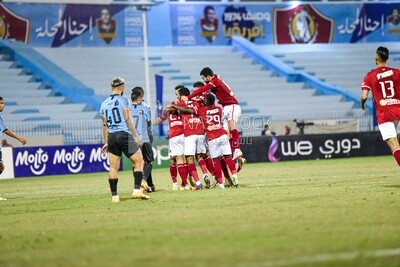 Football team celebrates after scoring a goal