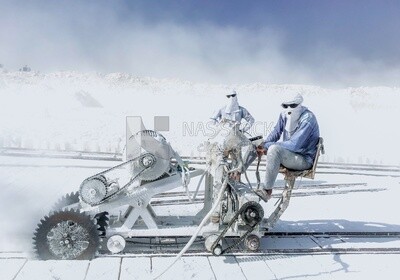 Craftsman working on a white brick machine