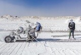 Craftsman working on a white brick machine