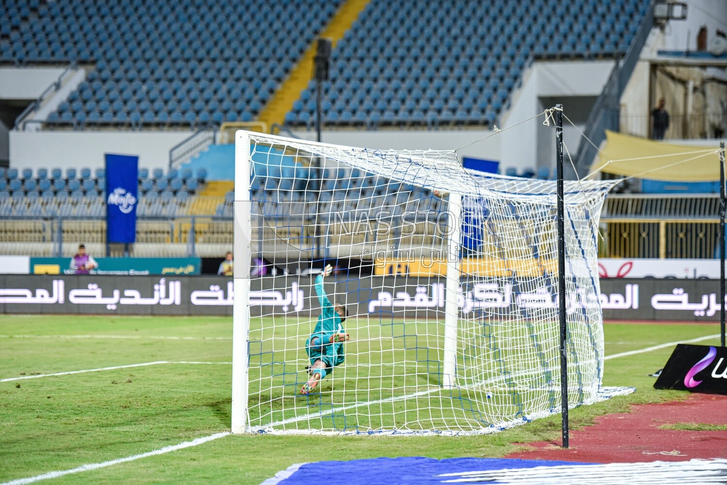 Goalkeeper tackles a ball that almost entered the goal