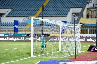 Goalkeeper tackles a ball that almost entered the goal