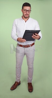 Photo of a handsome man with glasses and reading from a paper clipboard, business development and partnerships, business meeting, Model