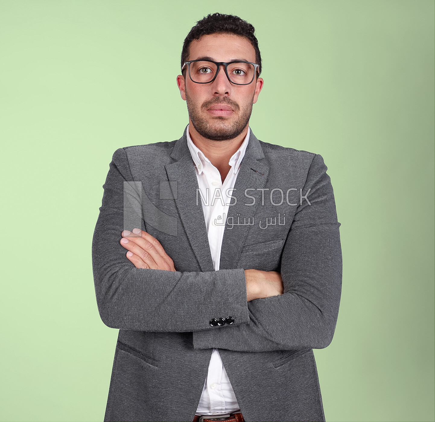 Portrait of a handsome man standing with glasses wearing formal suit with crossed hands, business development and partnerships, business meeting, Model