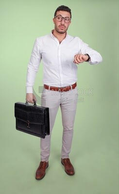 Photo of a handsome man wearing glasses and holding a leather bag and looking at the watch, business and partnership development, business meeting, model