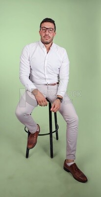 Photo of a handsome man with glasses sitting on a chair, business development and partnerships, business meeting, Model