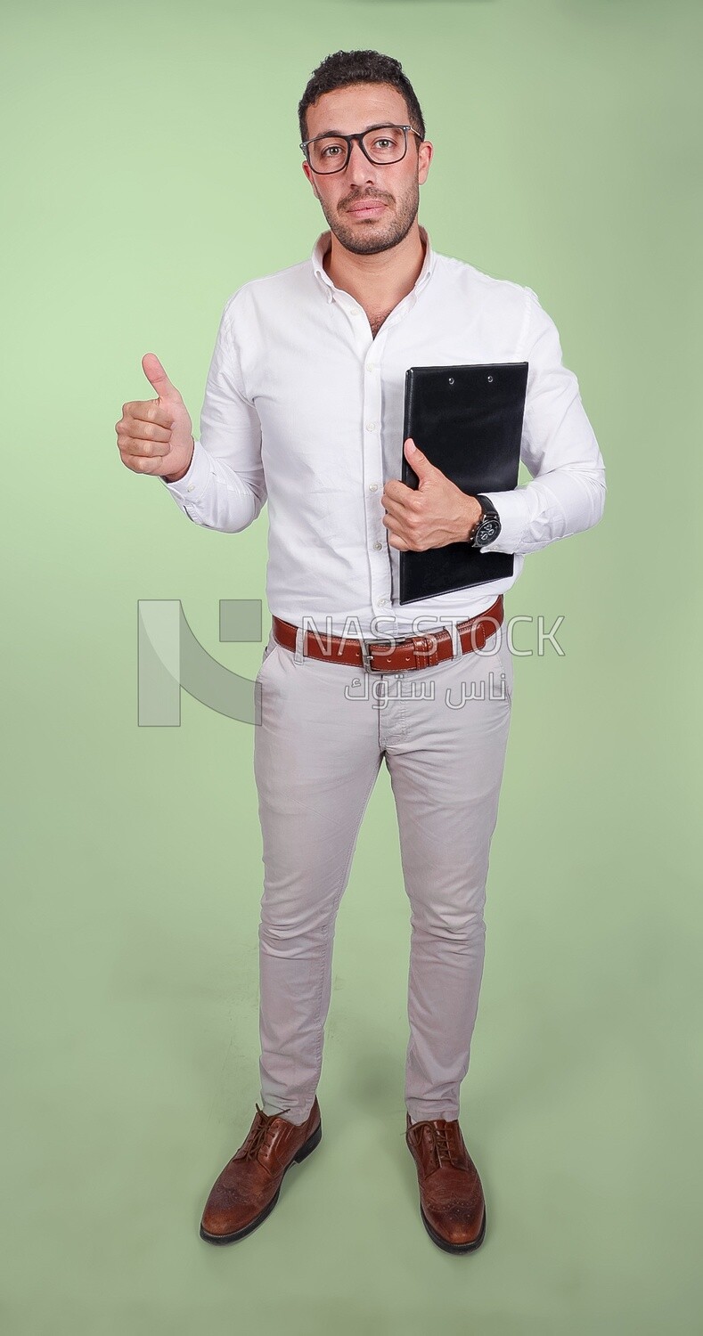 Photo of a handsome man with glasses holding a clipboard and thumb up hands, business development and partnerships, business meeting, Model